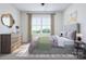 Bright bedroom with large window, dresser and neutral decor at 5676 Clear Creek Ln, Charlotte, NC 28215