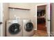 Laundry room with washer, dryer, and access to kitchen at 9693 Brandybuck Nw Dr, Charlotte, NC 28269