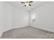 Simple bedroom with gray carpet and ceiling fan at 146 Tetcott St, Mooresville, NC 28115