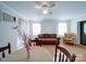 Combined living and dining area with hardwood floors and a ceiling fan at 1869 Emma Cir, Lancaster, SC 29720