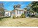 Side view of charming yellow house with landscaping at 402 W 7Th St, Newton, NC 28658