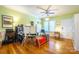 Bright home office with hardwood floors, desk, and window views at 402 W 7Th St, Newton, NC 28658