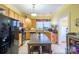 Kitchen boasts wood cabinets, stainless steel appliances, and an island with seating at 402 W 7Th St, Newton, NC 28658