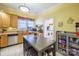Eat-in kitchen with wood cabinets, stainless steel appliances, and a laundry area at 402 W 7Th St, Newton, NC 28658