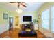 Bright living room with hardwood floors, fireplace, and built-in shelving at 402 W 7Th St, Newton, NC 28658
