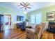 Spacious living room featuring hardwood floors, a fireplace, and comfortable seating at 402 W 7Th St, Newton, NC 28658