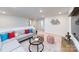 Spacious bonus room with L-shaped sectional sofa and a modern coffee table at 4356 Bronze Blvd, Sherrills Ford, NC 28673