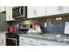 Modern kitchen features granite countertops and stainless steel appliances at 4356 Bronze Blvd, Sherrills Ford, NC 28673