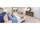 Bright bedroom featuring a king-size bed and a relaxing sitting area at 4356 Bronze Blvd, Sherrills Ford, NC 28673