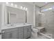 Modern bathroom with double vanity, shower, and gray tile at 659 District Ct # 20, Fort Mill, SC 29708