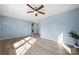 Spacious bedroom with light blue walls and wood-look floors at 108 W Maryland Ave, Bessemer City, NC 28016