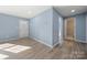 Bright entryway with light blue walls and wood-look floors at 108 W Maryland Ave, Bessemer City, NC 28016