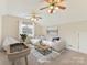 Virtually staged bonus room with ceiling fans and window at 129 Coronilla Rd, Mooresville, NC 28117