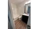 Bathroom with a toilet, shower/tub, and dark vanity at 1421 Mandy Place Ct, Charlotte, NC 28216