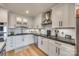 Modern kitchen featuring white shaker cabinets, stainless steel appliances, and a concrete countertop at 2036 Manila Bay Ln, Tega Cay, SC 29708