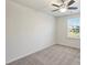 Spacious bedroom with ceiling fan and window at 2524 Wellshire Ct, Gastonia, NC 28056