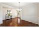 Formal dining room with hardwood floors and wainscoting at 2524 Wellshire Ct, Gastonia, NC 28056