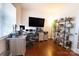 Home office with built-in shelving and hardwood floors at 2524 Wellshire Ct, Gastonia, NC 28056