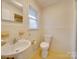 Clean bathroom with toilet, sink, and shower at 3113 Old Pageland Marshville Rd, Wingate, NC 28174