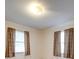 Bedroom with two windows, neutral walls, and carpeting at 3113 Old Pageland Marshville Rd, Wingate, NC 28174