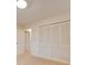 Bedroom with neutral walls, carpeting, and large closet with louvered doors at 3113 Old Pageland Marshville Rd, Wingate, NC 28174