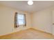 Simple bedroom with neutral walls, carpeting, and window with curtains at 3113 Old Pageland Marshville Rd, Wingate, NC 28174