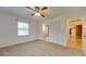 Spacious bedroom with ceiling fan, closet, and access to bathroom at 3113 Old Pageland Marshville Rd, Wingate, NC 28174