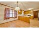 Light and airy dining area adjacent to kitchen with wood flooring and chandelier at 3113 Old Pageland Marshville Rd, Wingate, NC 28174