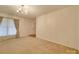 Dining room with chandelier and neutral carpeting at 3113 Old Pageland Marshville Rd, Wingate, NC 28174