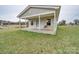 Small house with a covered porch and grassy yard at 3113 Old Pageland Marshville Rd, Wingate, NC 28174