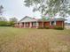 Brick ranch house with covered porch and large yard at 3113 Old Pageland Marshville Rd, Wingate, NC 28174