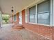 Brick front porch with steps leading to the front door at 3113 Old Pageland Marshville Rd, Wingate, NC 28174