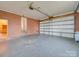 Spacious garage with brick wall and automatic door at 3113 Old Pageland Marshville Rd, Wingate, NC 28174