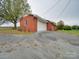 Attached garage with large white door and brick exterior at 3113 Old Pageland Marshville Rd, Wingate, NC 28174