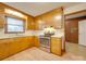 Kitchen with wood cabinets, stainless steel appliances, and a double sink at 3113 Old Pageland Marshville Rd, Wingate, NC 28174
