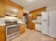 Kitchen with wood cabinets, stainless steel range, and refrigerator with water dispenser at 3113 Old Pageland Marshville Rd, Wingate, NC 28174