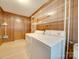 Laundry room with washer, dryer, and ample storage at 3113 Old Pageland Marshville Rd, Wingate, NC 28174