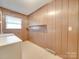 Laundry room with washer, dryer, and built-in shelving at 3113 Old Pageland Marshville Rd, Wingate, NC 28174
