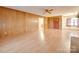 Living room with hardwood floors and wood paneling at 3113 Old Pageland Marshville Rd, Wingate, NC 28174