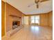 Living room with brick fireplace and wood paneling at 3113 Old Pageland Marshville Rd, Wingate, NC 28174