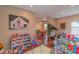 Playroom with built-in shelving, toys, and view into dining area at 3125 Harris Houston Rd, Charlotte, NC 28262