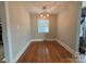 Formal dining area with hardwood floors and a window at 3427 Eastway Dr, Charlotte, NC 28205