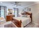 Main bedroom with a large bed, dresser, and plenty of natural light at 3848 Zemosa Nw Ln, Concord, NC 28027