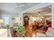 Open living room with a view into the kitchen and hardwood floors at 3848 Zemosa Nw Ln, Concord, NC 28027