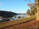 Scenic lake view with boat docks at 455 Pine Lake Dr, Troy, NC 27371