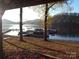 Serene waterfront view with boats docked at the marina at 455 Pine Lake Dr, Troy, NC 27371