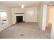 Spacious living room with a fireplace and ceiling fan at 455 Pine Lake Dr, Troy, NC 27371