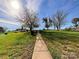 Landscaped backyard with walkway and shed at 5425 Creekwood Dr, Salisbury, NC 28147