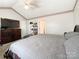 Primary bedroom with king bed, TV, and private bathroom access at 5425 Creekwood Dr, Salisbury, NC 28147