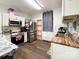Kitchen with stainless steel appliances and wood-look flooring at 5425 Creekwood Dr, Salisbury, NC 28147